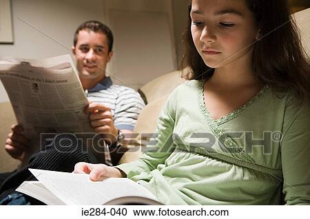 A father and daughter reading in the lounge View Large Photo Image Stock Image - A father and daughter reading in the lounge. Fotosearch
