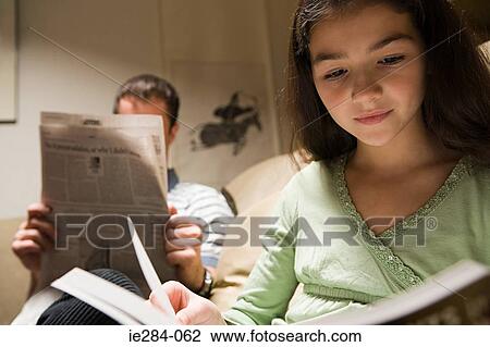 A father and daughter reading in the lounge View Large Photo Image Stock Image - A father and daughter reading in the lounge. Fotosearch