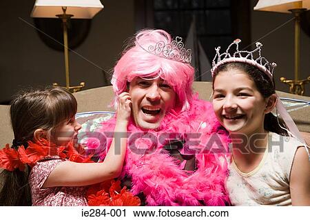 A father and his daughters playing fancy dress View Large Photo Image Stock Image - A father and his daughters playing fancy dress. Fotosearch