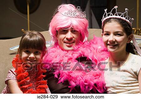 A father and his daughters playing fancy dress View Large Photo Image Stock Photo - A father and his daughters playing fancy dress. Fotosearch