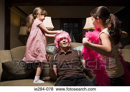 A father and his daughters playing fancy dress View Large Photo Image Stock Photo - A father and his daughters playing fancy dress. Fotosearch