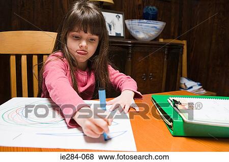 Stock Photo - A girl drawing. Fotosearch