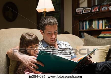 Father and daughter reading a book View Large Photo Image Stock Photography - Father and daughter reading a book. Fotosearch