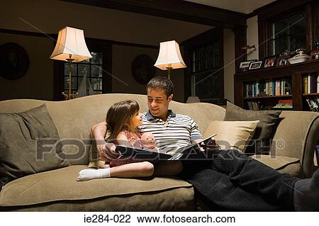 Father and daughter with a book View Large Photo Image Stock Image - Father and daughter with a book. Fotosearch
