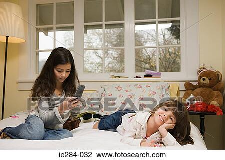 Sisters in their bedroom View Large Photo Image Stock Image - Sisters in their bedroom. Fotosearch