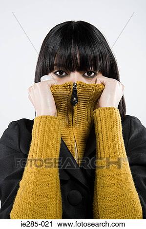 Japanes woman peering over sweater View Large Photo Image Stock Image - Japanes woman peering over sweater. Fotosearch