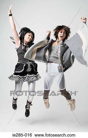 Stock Photograph - Women jumping for joy. Fotosearch