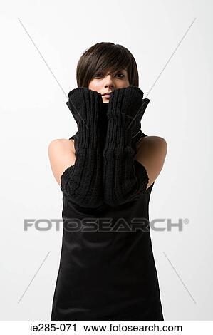 Young woman wearing black gloves View Large Photo Image Stock Image - Young woman wearing black gloves. Fotosearch