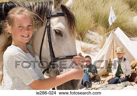 Picture - A girl with a horse. Fotosearch