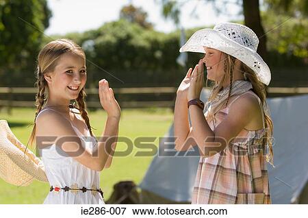 Two girls playing pat a cake View Large Photo Image Stock Photo - Two girls playing pat a cake. Fotosearch