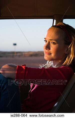 A woman in a car View Large Photo Image Picture - A woman in a car. Fotosearch