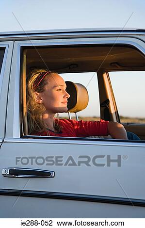 Stock Image - A woman in a car. Fotosearch