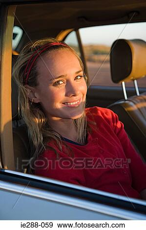 A woman in a car View Large Photo Image Stock Photo - A woman in a car. Fotosearch