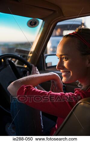 Stock Image - A woman sat in a car. Fotosearch