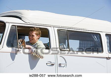 A young man in a camper van View Large Photo Image Stock Photo - A young man in a camper van. Fotosearch