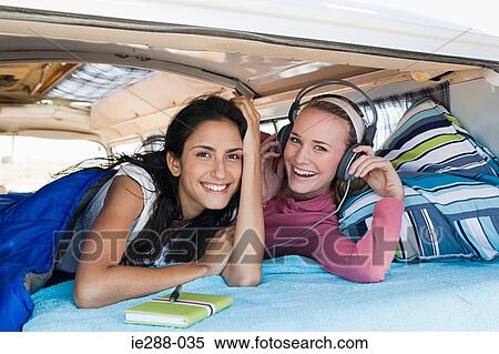 Friends in a camper van View Large Photo Image Stock Photography - Friends in a camper van. Fotosearch