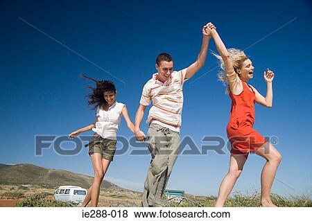 Friends skipping View Large Photo Image Stock Photo - Friends skipping. Fotosearch