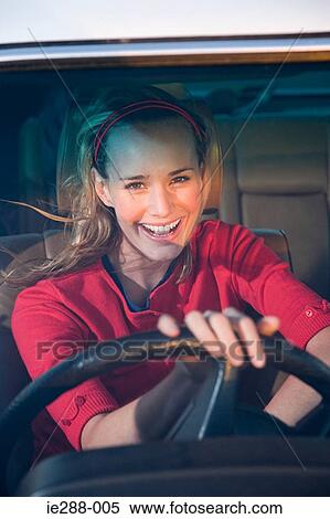 Young woman driving View Large Photo Image Stock Photography - Young woman driving. Fotosearch