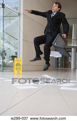 Stock Photo - Businessman slipping up. Fotosearch