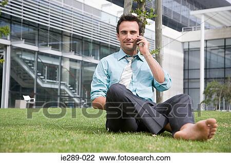 Stock Image - Businessman taking a break. Fotosearch