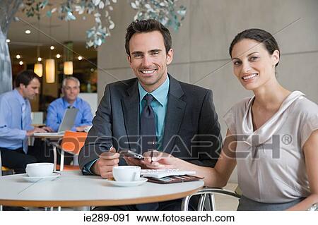 Stock Image - Colleagues having coffee. Fotosearch