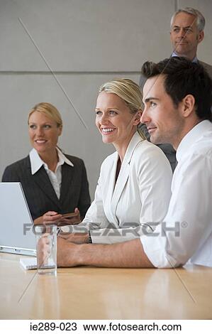 Colleagues in meeting View Large Photo Image Stock Image - Colleagues in meeting. Fotosearch