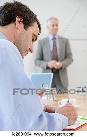 Man writing in presentation View Large Photo Image Picture - Man writing in presentation. Fotosearch