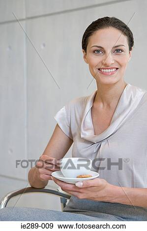 Stock Photo - Woman having coffee. Fotosearch