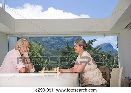 A senior couple playing chess View Large Photo Image Stock Image - A senior couple playing chess. Fotosearch