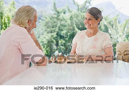 A senior couple playing chess View Large Photo Image Stock Photograph - A senior couple playing chess. Fotosearch