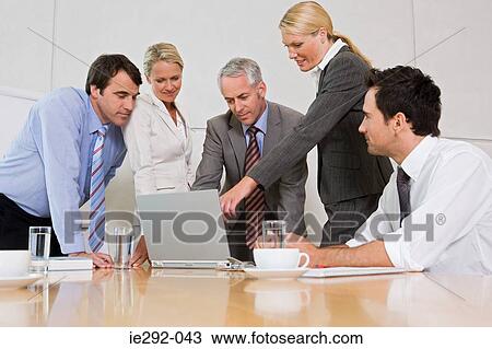 Stock Image - Business colleagues in a meeting. Fotosearch