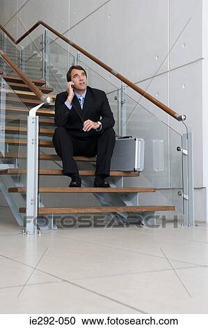Businessman sitting on steps View Large Photo Image Stock Image - Businessman sitting on steps. Fotosearch