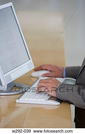 Businessman using computer View Large Photo Image Stock Photo - Businessman using computer. Fotosearch