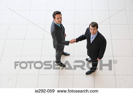 Stock Photo - Businessmen shaking hands. Fotosearch