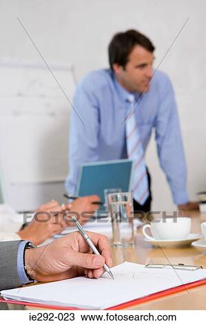 Businesspeople in a meeting View Large Photo Image Stock Image - Businesspeople in a meeting. Fotosearch