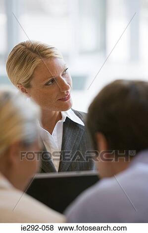 Businesswoman in a meeting View Large Photo Image Stock Photo - Businesswoman in a meeting. Fotosearch