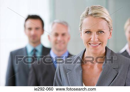Businesswoman with colleagues View Large Photo Image Stock Image - Businesswoman with colleagues. Fotosearch