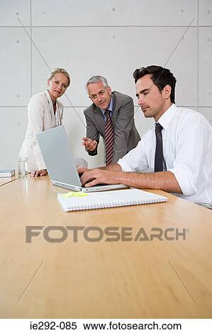 Stock Photography - Colleagues in a meeting. Fotosearch