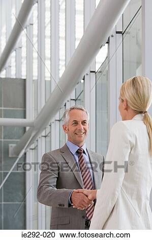 Colleagues shaking hands View Large Photo Image Stock Image - Colleagues shaking hands. Fotosearch