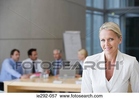 Stock Photo - Female manager with team. Fotosearch