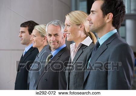Five businesspeople in a row View Large Photo Image Stock Image - Five businesspeople in a row. Fotosearch