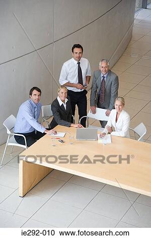 Five colleagues in a meeting View Large Photo Image Stock Image - Five colleagues in a meeting. Fotosearch