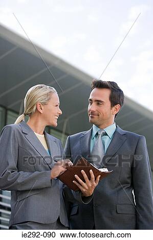 Stock Image - Smiling business colleagues. Fotosearch