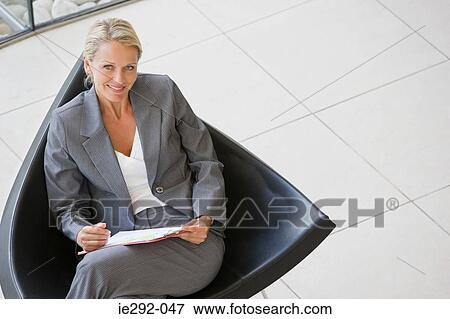 Smiling businesswoman with clipboard View Large Photo Image Stock Photo - Smiling businesswoman with clipboard. Fotosearch