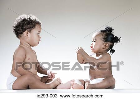Stock Image - A baby boy and baby girl. Fotosearch
