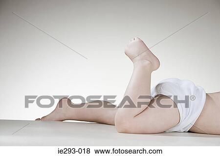 A babys legs View Large Photo Image Stock Photo - A babys legs. Fotosearch