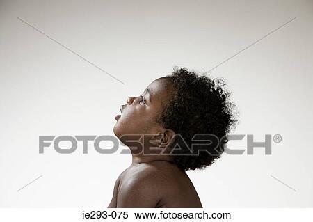 Stock Photography - Profile of a baby boy. Fotosearch