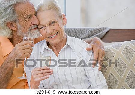 Couple having champagne View Large Photo Image Stock Photo - Couple having champagne. Fotosearch
