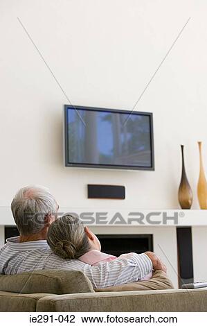 Stock Image - Couple watching television. Fotosearch