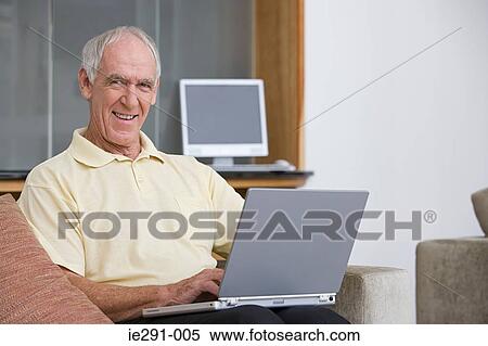 Stock Photography - Man using laptop. Fotosearch